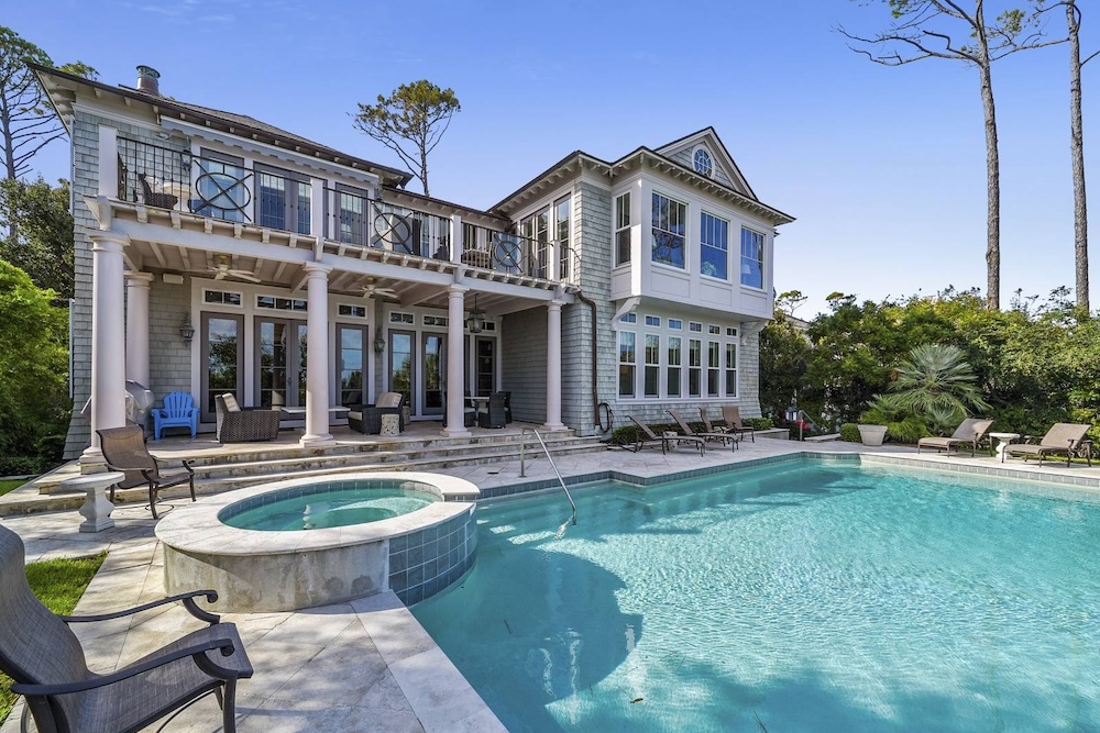 view of pool and hot tub of a hilton head vacation rental from beach properties